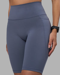Woman wearing Fusion Ultra High-Rise 9" Short Pockets - Night Shadow | Model:Rhiley | Size:S | Thumbnail Index: 5