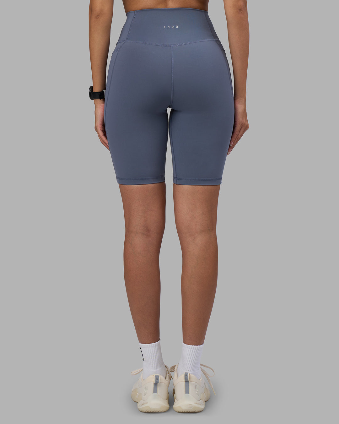 Woman wearing Fusion Ultra High-Rise 9" Short Pockets - Night Shadow | Model:Rhiley | Size:S - view 4