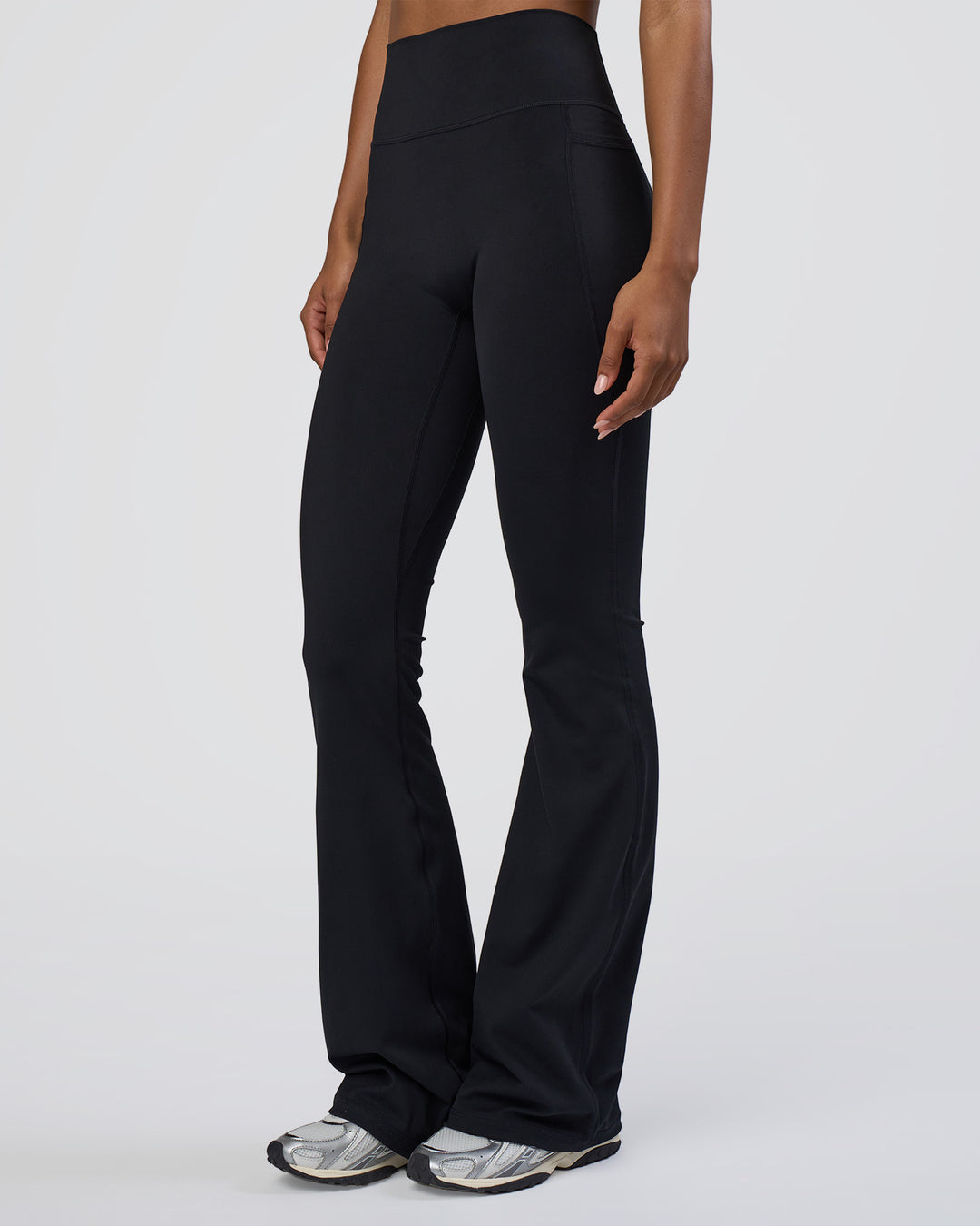 Woman wearing Fusion Ultra High-Rise Flared Tall Legging Pockets - Black | Model:Tomi | Size:S - view 5