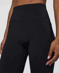 Woman wearing Fusion Ultra High-Rise Flared Tall Legging Pockets - Black | Model:Tomi | Size:S | Thumbnail Index: 5