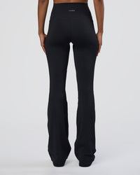 Woman wearing Fusion Ultra High-Rise Flared Tall Legging Pockets - Black | Model:Tomi | Size:S | Thumbnail Index: 3