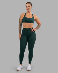 Woman wearing Fusion Ultra High-Rise Full Length Legging Pockets - Dark Moss | Model:Robyn | Size:S | Thumbnail Index: 1