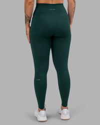 Woman wearing Fusion Ultra High-Rise Full Length Legging Pockets - Dark Moss | Model:Robyn | Size:S | Thumbnail Index: 3