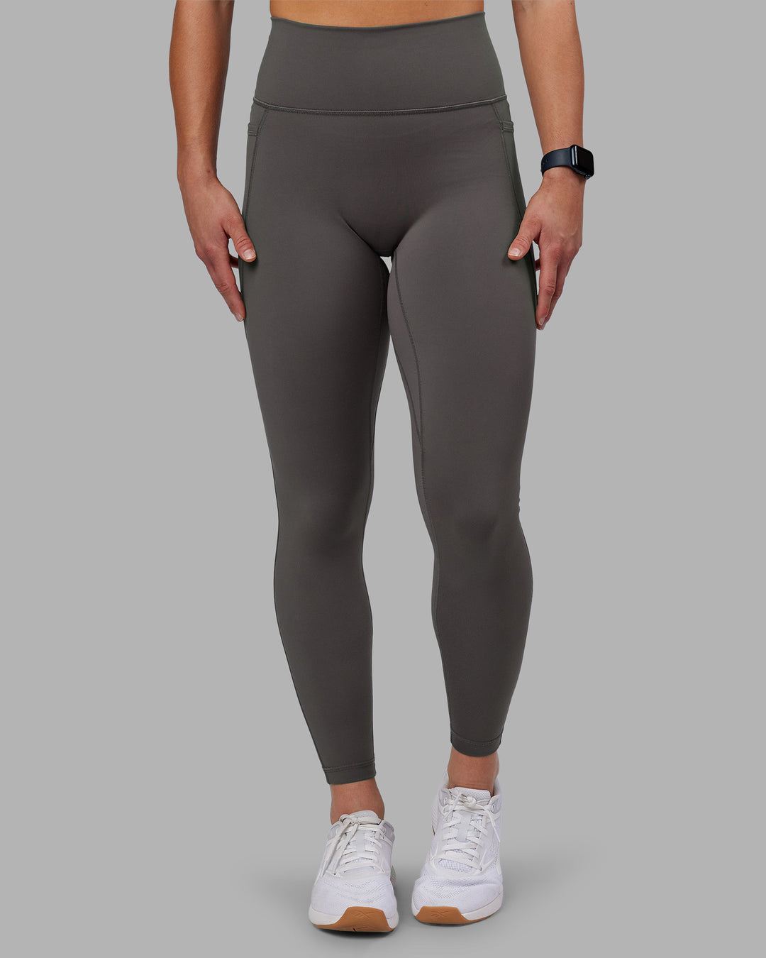 Woman wearing Fusion Ultra High-Rise Full Length Legging Pockets - Dark Storm | Model:Keisha | Size:S - view 1