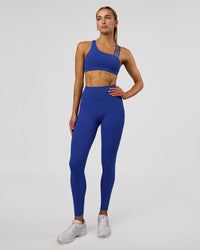 Woman wearing Fusion Ultra High-Rise Full Length Legging Pockets - Electric Indigo | Model:Evie | Size:S | Thumbnail Index: 0
