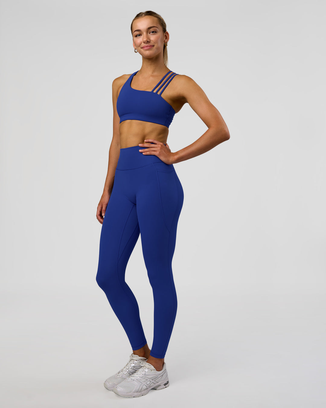 Woman wearing Fusion Ultra High-Rise Full Length Legging Pockets - Electric Indigo | Model:Evie | Size:S - view 5