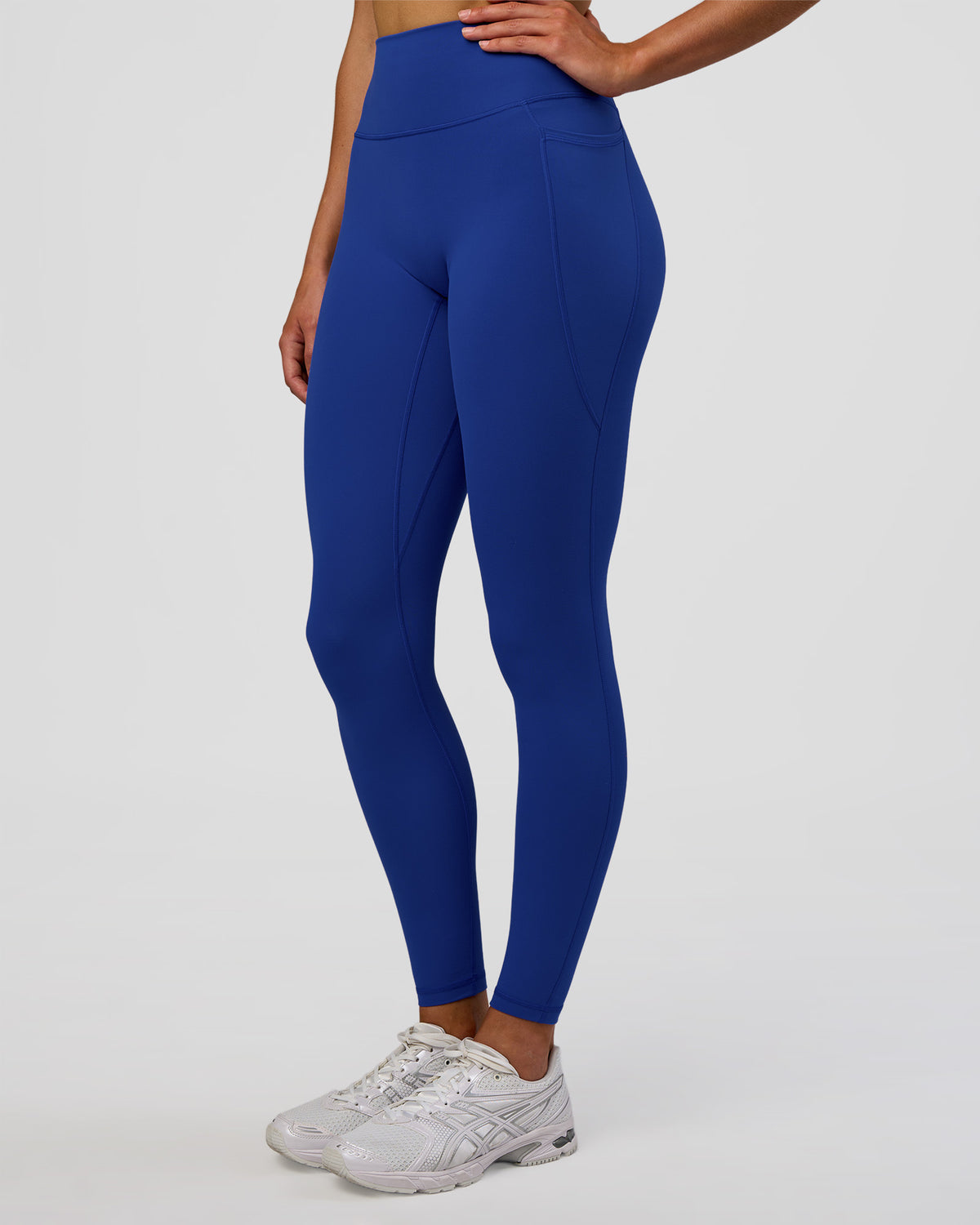 Woman wearing Fusion Ultra High-Rise Full Length Legging Pockets - Electric Indigo | Model:Evie | Size:S