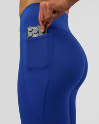 Woman wearing Fusion Ultra High-Rise Full Length Legging Pockets - Electric Indigo | Model:Evie | Size:S | Thumbnail Index: 2