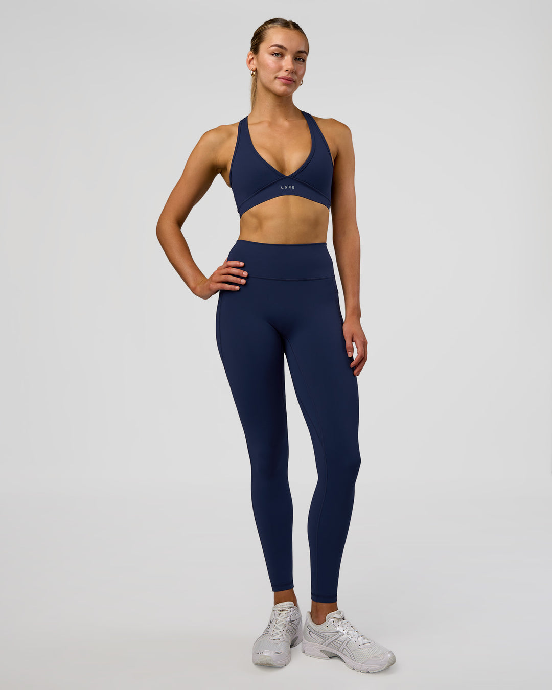 Woman wearing Fusion Ultra High-Rise Full Length Legging Pockets - Future Navy | Model:Evie | Size:S - view 5