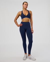 Woman wearing Fusion Ultra High-Rise Full Length Legging Pockets - Future Navy | Model:Evie | Size:S | Thumbnail Index: 4