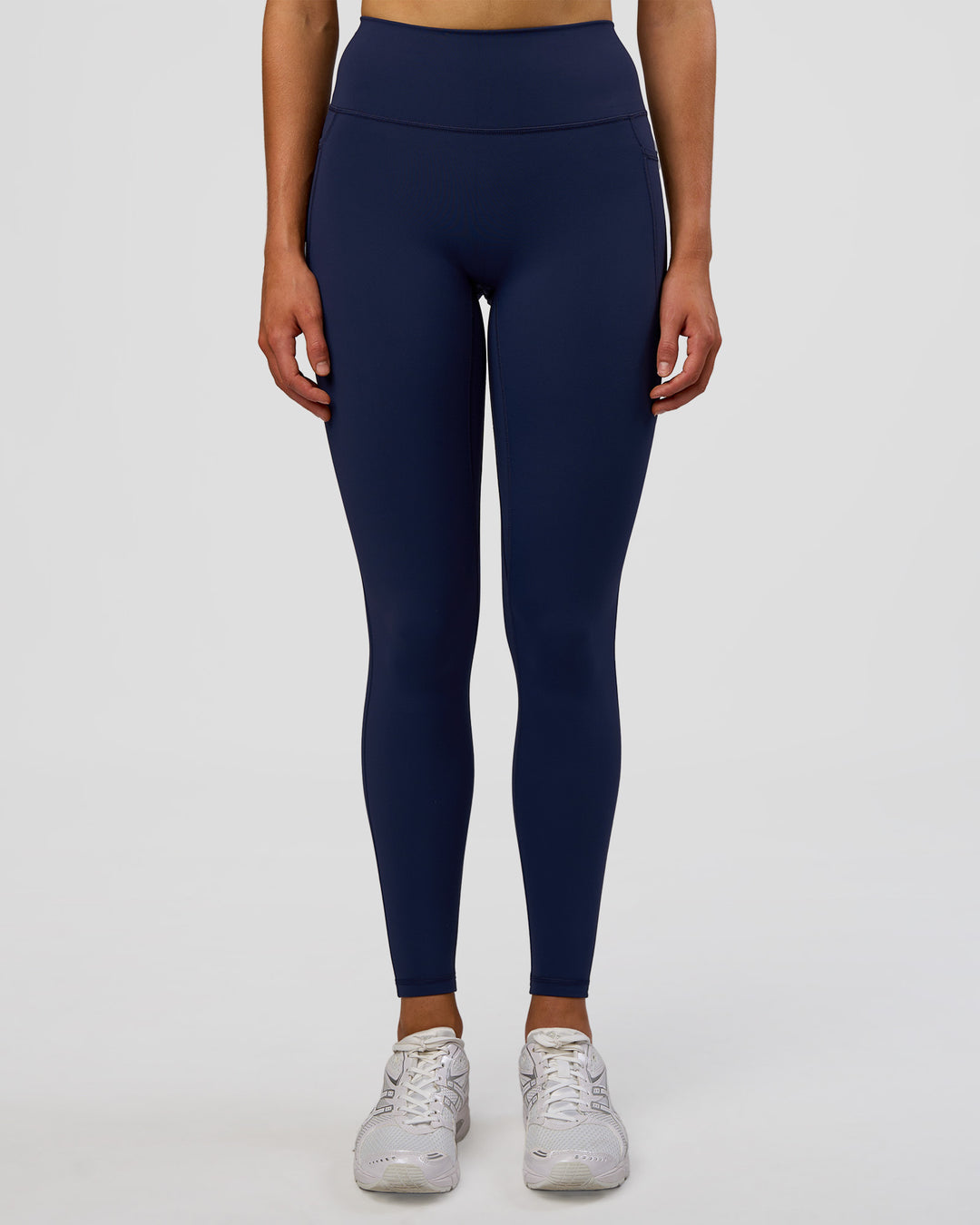Woman wearing Fusion Ultra High-Rise Full Length Legging Pockets - Future Navy | Model:Evie | Size:S - view 2
