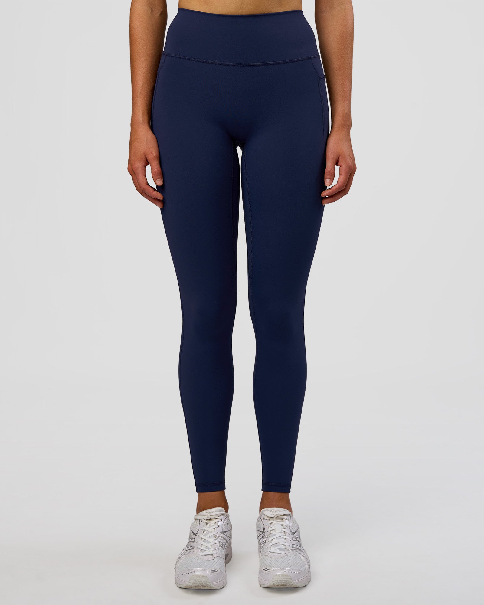 Woman wearing Fusion Ultra High-Rise Full Length Legging Pockets - Future Navy | Model:Evie | Size:S