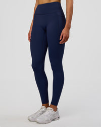 Woman wearing Fusion Ultra High-Rise Full Length Legging Pockets - Future Navy | Model:Evie | Size:S | Thumbnail Index: 5