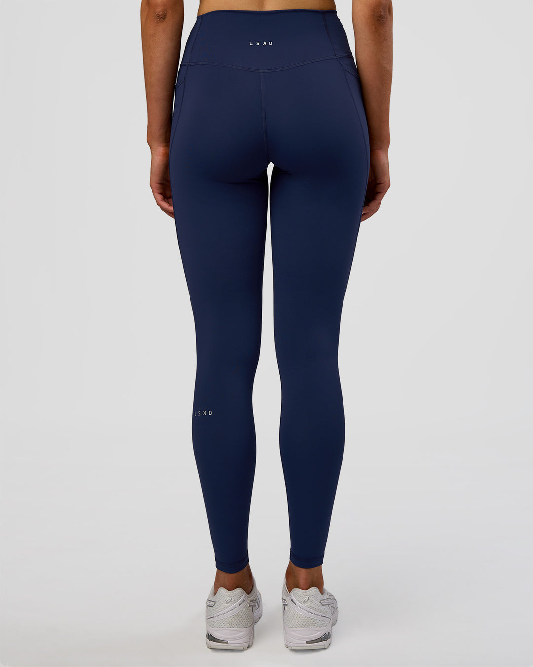 Woman wearing Fusion Ultra High-Rise Full Length Legging Pockets - Future Navy | Model:Evie | Size:S - view 4