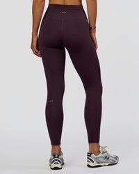 Woman wearing Fusion Ultra High-Rise Full Length Legging Pockets - Midnight Plum | Model:Amity | Size:S | Thumbnail Index: 3