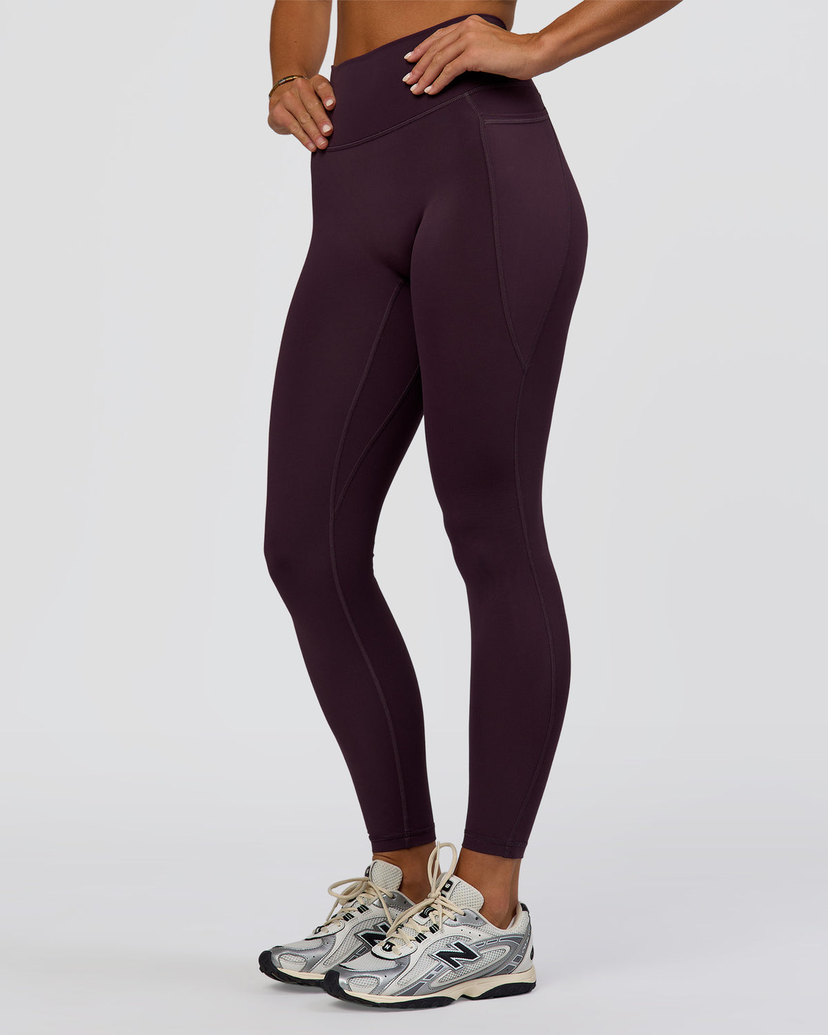 Woman wearing Fusion Ultra High-Rise Full Length Legging Pockets - Midnight Plum | Model:Amity | Size:S