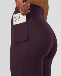 Woman wearing Fusion Ultra High-Rise Full Length Legging Pockets - Midnight Plum | Model:Amity | Size:S | Thumbnail Index: 2