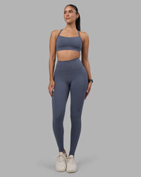 Woman wearing Fusion Ultra High-Rise Full Length Legging Pockets - Night Shadow | Model:Rhiley | Size:S | Thumbnail Index: 1