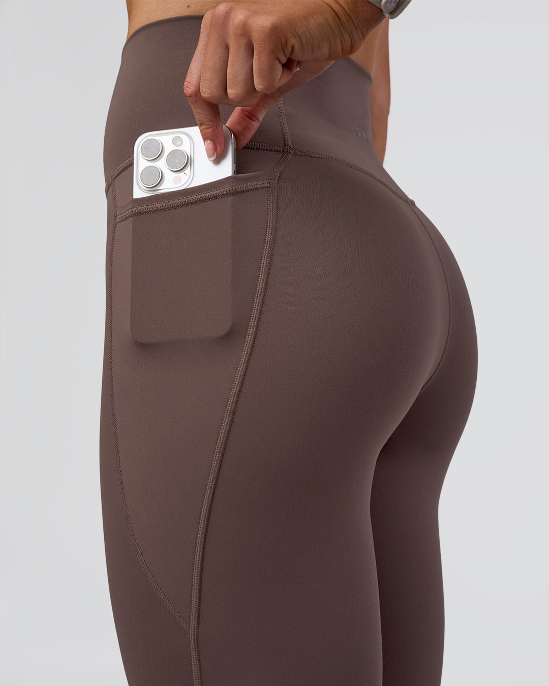 Woman wearing Fusion Ultra High-Rise Full Length Legging Pockets - Peppercorn | Model:Emelia | Size:S - view 3