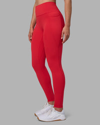 Woman wearing Fusion Ultra High-Rise Full Length Legging Pockets - Scarlet | Model:Sophie | Size:S | Thumbnail Index: 1
