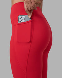 Woman wearing Fusion Ultra High-Rise Full Length Legging Pockets - Scarlet | Model:Sophie | Size:S | Thumbnail Index: 2