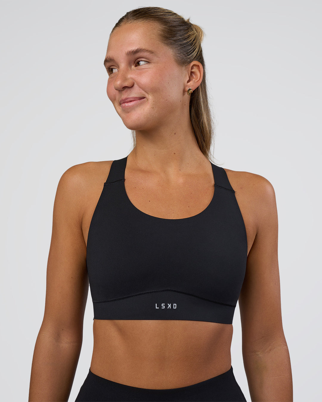 Woman wearing Fusion Sports Bra 2.0 - Black | Model:Amity | Size:S - view 1