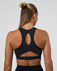 Woman wearing Fusion Sports Bra 2.0 - Black | Model:Amity | Size:S | Thumbnail Index: 1