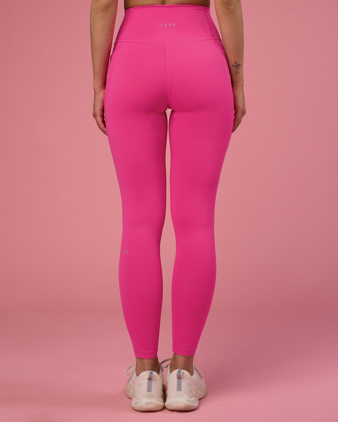 Woman wearing Fusion Ultra High-Rise Full Length Legging Pockets - Ultra Pink | Model:Tianah | Size:S - view 3