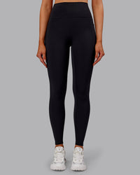 Woman wearing Fusion Ultra High-Rise Full Length Thermal Legging Pockets - Black | Model:Ella | Size:S | Thumbnail Index: 0