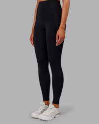 Woman wearing Fusion Ultra High-Rise Full Length Thermal Legging Pockets - Black | Model:Ella | Size:S | Thumbnail Index: 6