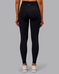 Woman wearing Fusion Ultra High-Rise Full Length Thermal Legging Pockets - Black | Model:Ella | Size:S | Thumbnail Index: 3