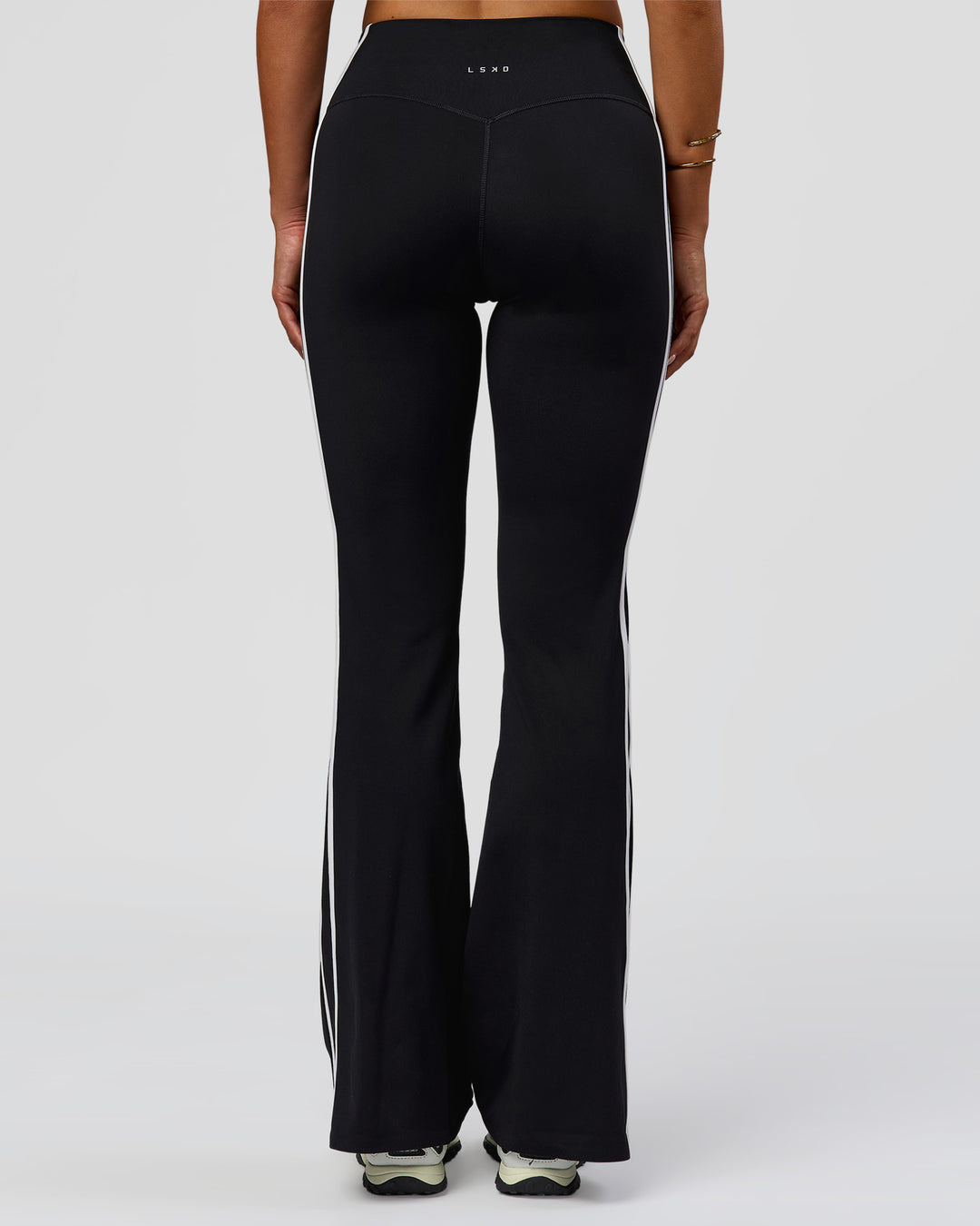 Woman wearing Fusion V-Contour Bind High-Rise Flared Legging - Black-white | Model:Bianca | Size:S - view 2