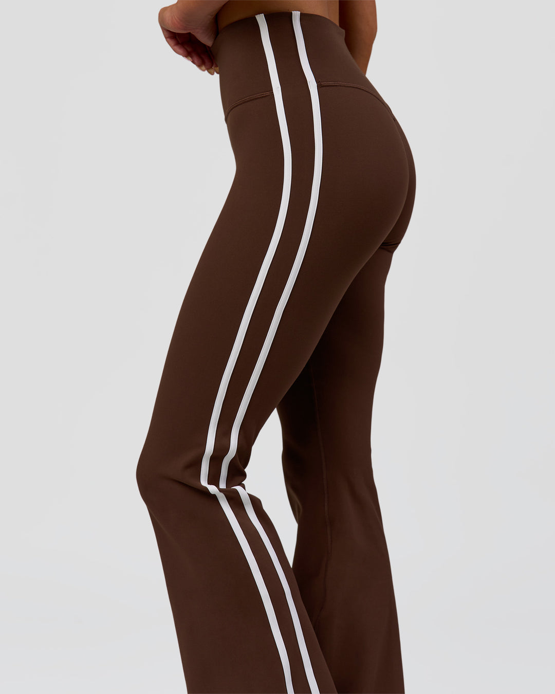 Woman wearing Fusion V-Contour Bind High-Rise Flared Legging - Hot Chocolate-white | Model:Bianca | Size:S - view 9