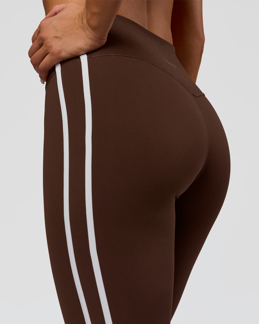 Woman wearing Fusion V-Contour Bind High-Rise Flared Legging - Hot Chocolate-white | Model:Bianca | Size:S - view 1
