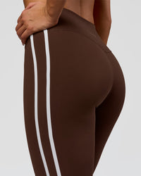 Woman wearing Fusion V-Contour Bind High-Rise Flared Legging - Hot Chocolate-white | Model:Bianca | Size:S | Thumbnail Index: 0