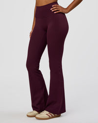 Woman wearing Fusion V-Contour High-Rise Flared Legging Pockets - Cherry Lacquer | Model:Jordan | Size:S | Thumbnail Index: 1
