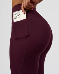 Woman wearing Fusion V-Contour High-Rise Flared Legging Pockets - Cherry Lacquer | Model:Jordan | Size:S | Thumbnail Index: 4