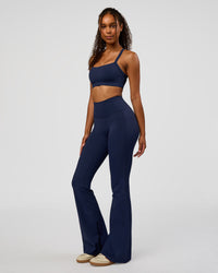 Woman wearing Fusion V-Contour High-Rise Flared Legging Pockets - Future Navy | Model:Jordan | Size:S | Thumbnail Index: 10
