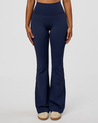 Woman wearing Fusion V-Contour High-Rise Flared Legging Pockets - Future Navy | Model:Jordan | Size:S | Thumbnail Index: 5