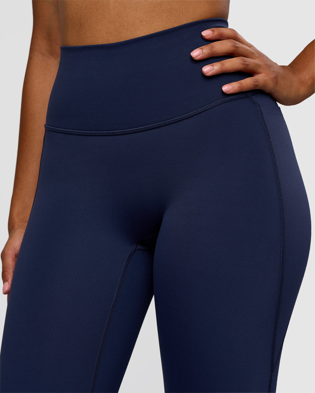 Woman wearing Fusion V-Contour High-Rise Flared Legging Pockets - Future Navy | Model:Jordan | Size:S - view 10