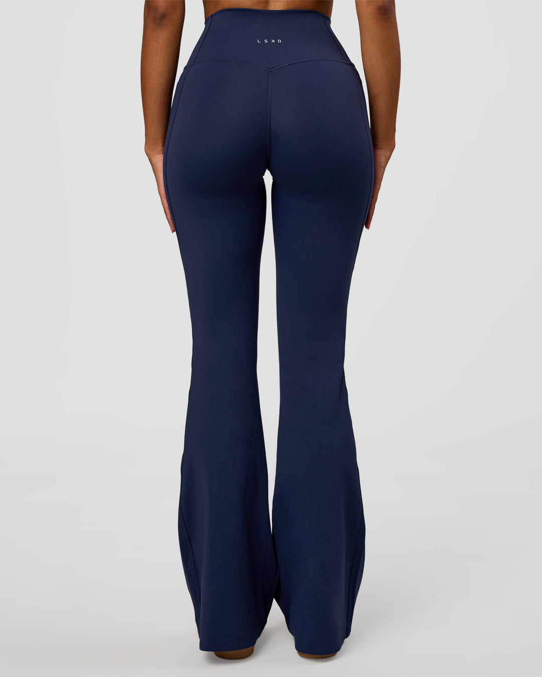 Woman wearing Fusion V-Contour High-Rise Flared Legging Pockets - Future Navy | Model:Jordan | Size:S - view 9