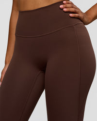 Woman wearing Woman wearing Fusion V-Contour High-Rise Flared Legging Pockets - Hot Chocolate | Model:Jordan | Size:S | Thumbnail Index: 5