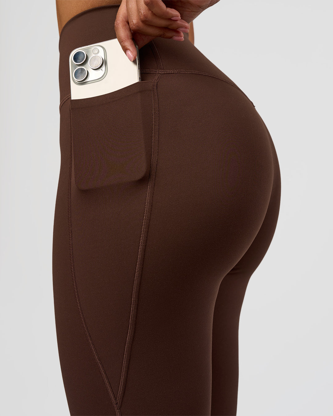 Woman wearing Woman wearing Fusion V-Contour High-Rise Flared Legging Pockets - Hot Chocolate | Model:Jordan | Size:S - view 4