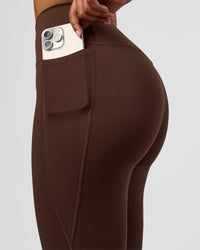 Woman wearing Woman wearing Fusion V-Contour High-Rise Flared Legging Pockets - Hot Chocolate | Model:Jordan | Size:S | Thumbnail Index: 3