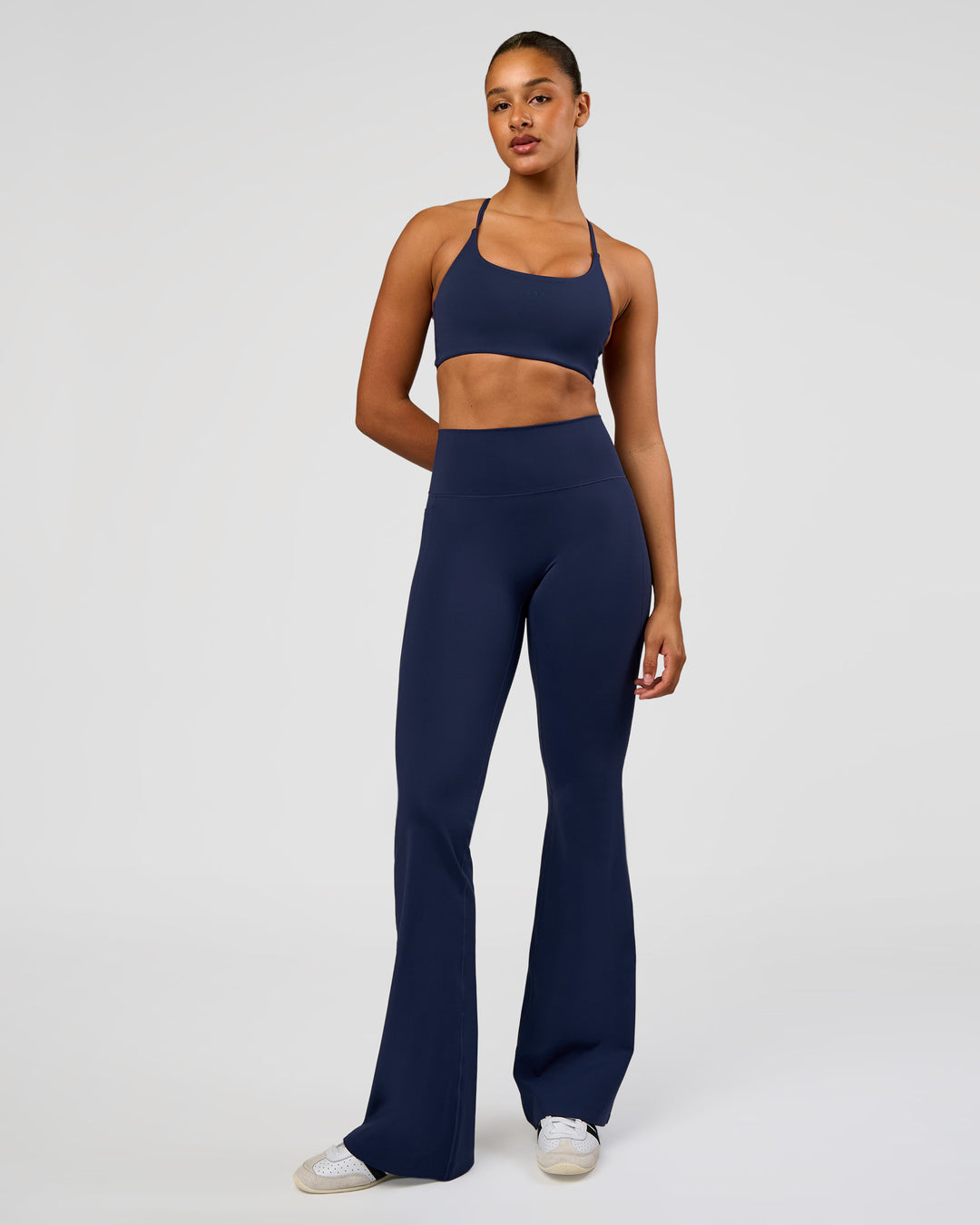 Woman wearing Fusion V-Contour High-Rise Flared Tall Legging Pockets - Future Navy | Model:Rosie | Size:S - view 4