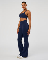 Woman wearing Fusion V-Contour High-Rise Flared Tall Legging Pockets - Future Navy | Model:Rosie | Size:S | Thumbnail Index: 5