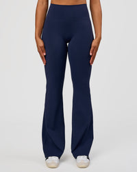 Woman wearing Fusion V-Contour High-Rise Flared Tall Legging Pockets - Future Navy | Model:Rosie | Size:S | Thumbnail Index: 6