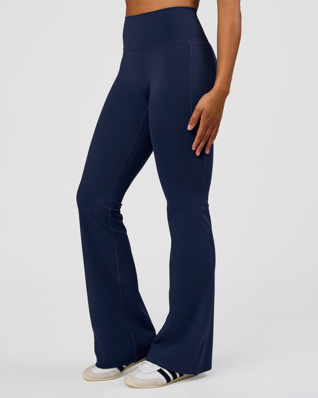 Woman wearing Fusion V-Contour High-Rise Flared Tall Legging Pockets - Future Navy | Model:Rosie | Size:S - view 3