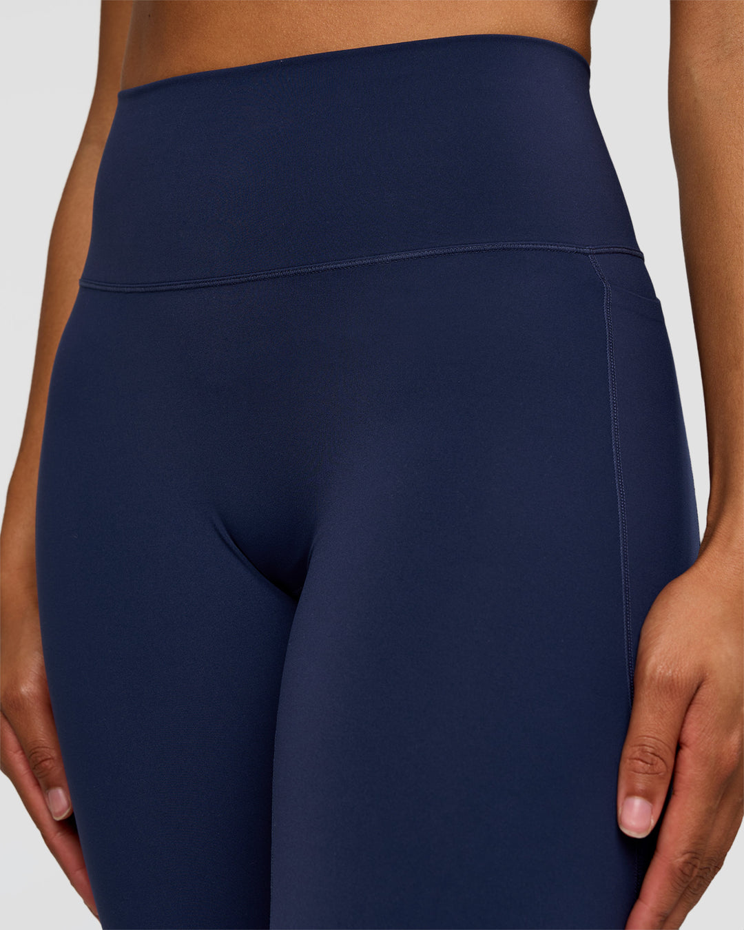 Woman wearing Fusion V-Contour High-Rise Flared Tall Legging Pockets - Future Navy | Model:Rosie | Size:S - view 5
