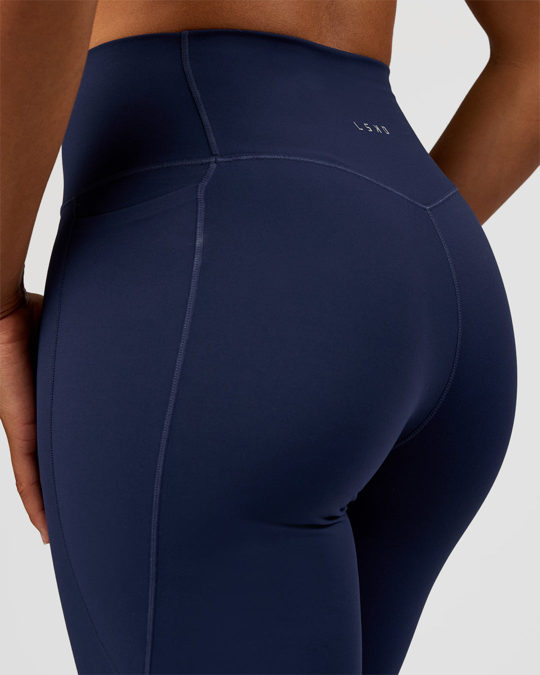 Woman wearing Fusion V-Contour High-Rise Flared Tall Legging Pockets - Future Navy | Model:Rosie | Size:S - view 8
